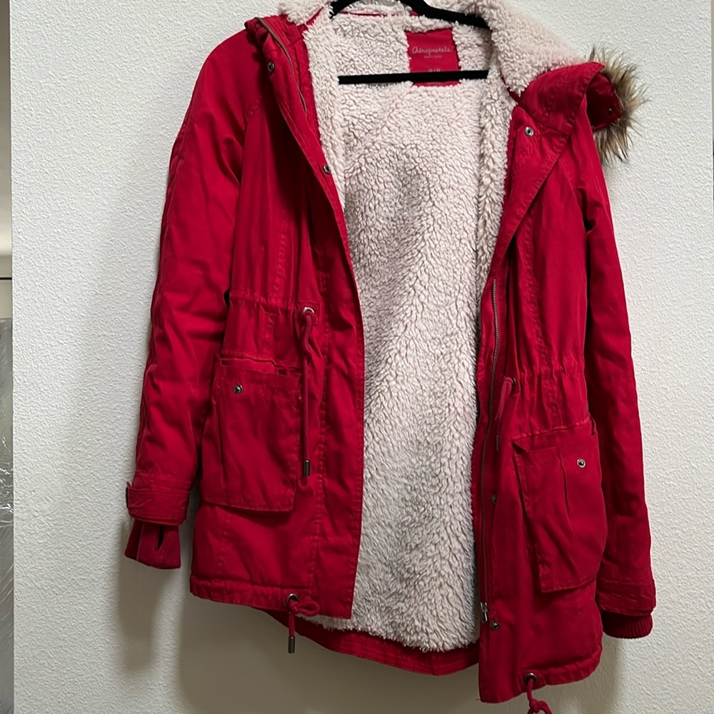 Red winter jacket with fur lined hood